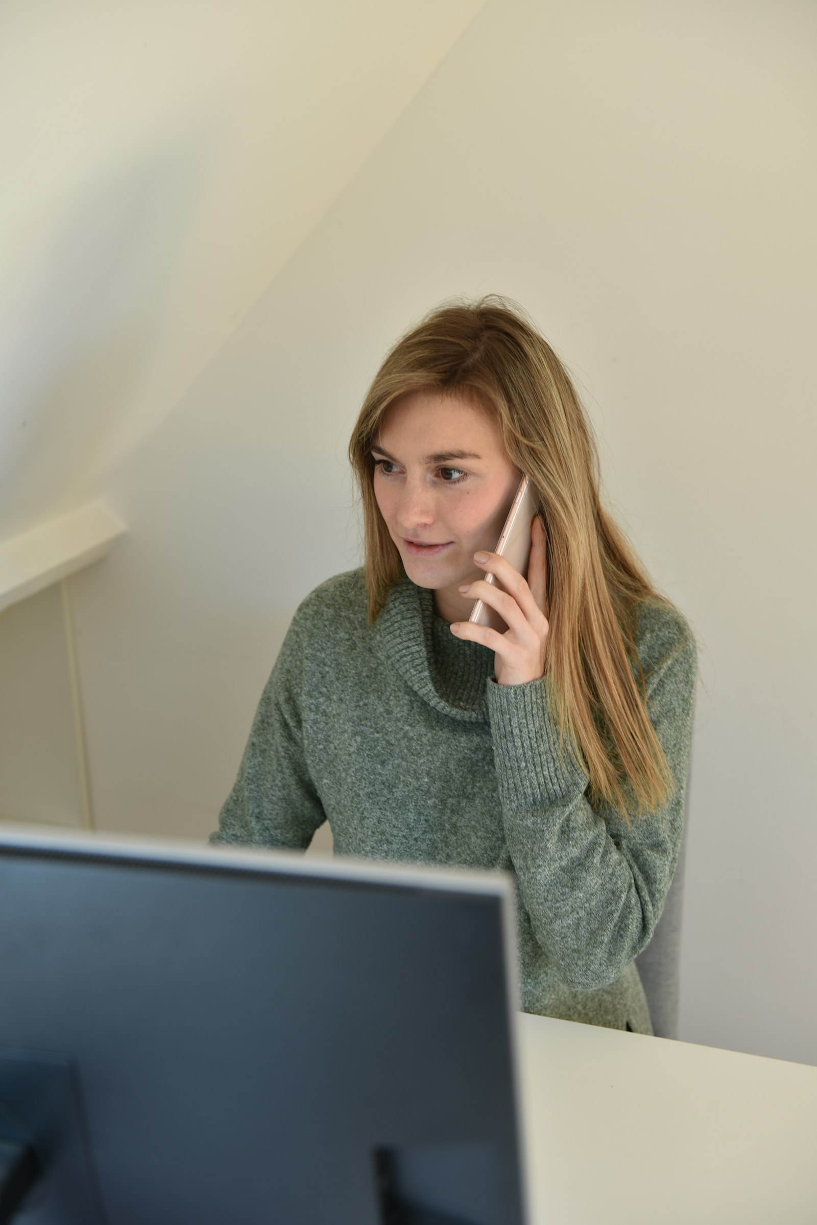 Small business owner answering a phone call from a customer
